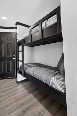 a view of storage and utility room with wooden floor