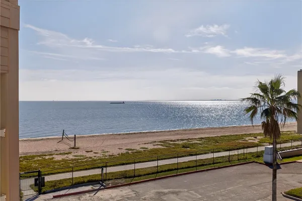 a view of a room with window and wooden floor
