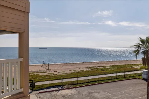 a view of a swimming pool with outdoor seating