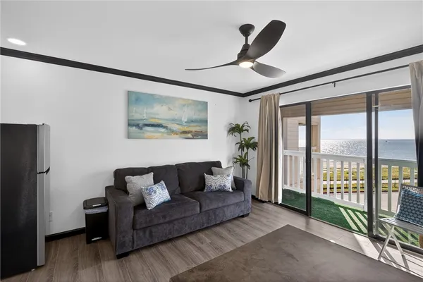 a kitchen with a sink a stove and cabinets