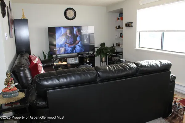 a living room with furniture and a window