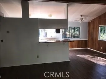 a kitchen with a sink and mirror