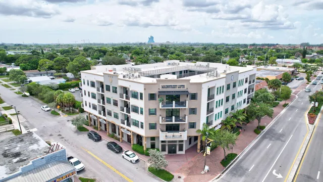 a view of a large building with a yard