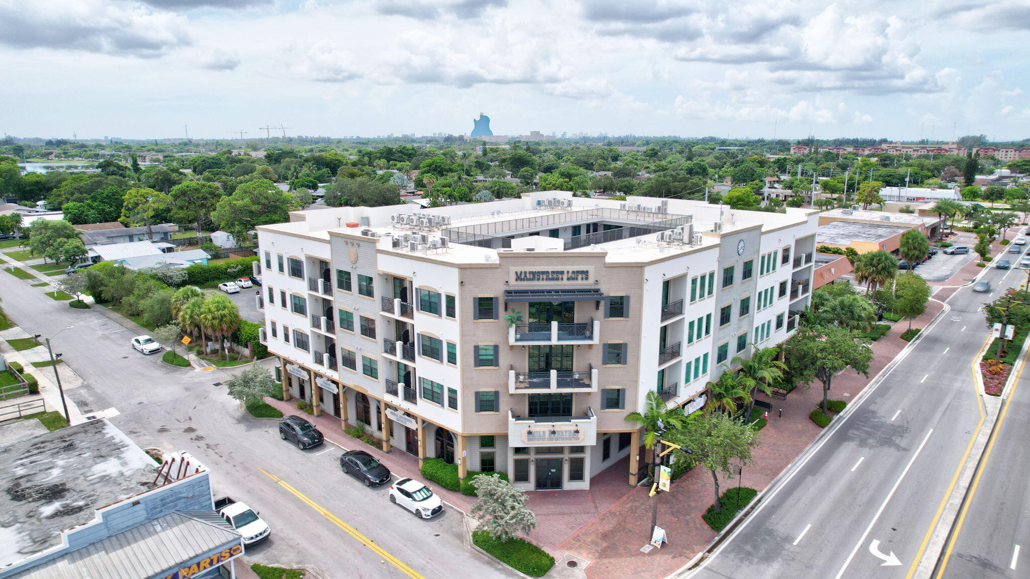 4100 Southwest 64th Avenue, Unit 315 Davie, FL 33314 - Photo 13 of 16 a view of a large building with a yard