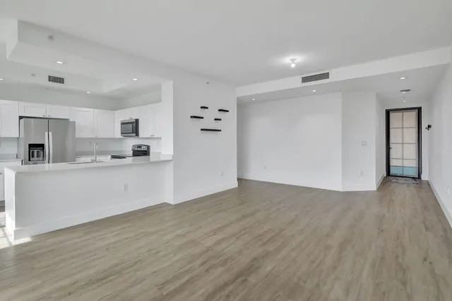 a view of kitchen with wooden floor