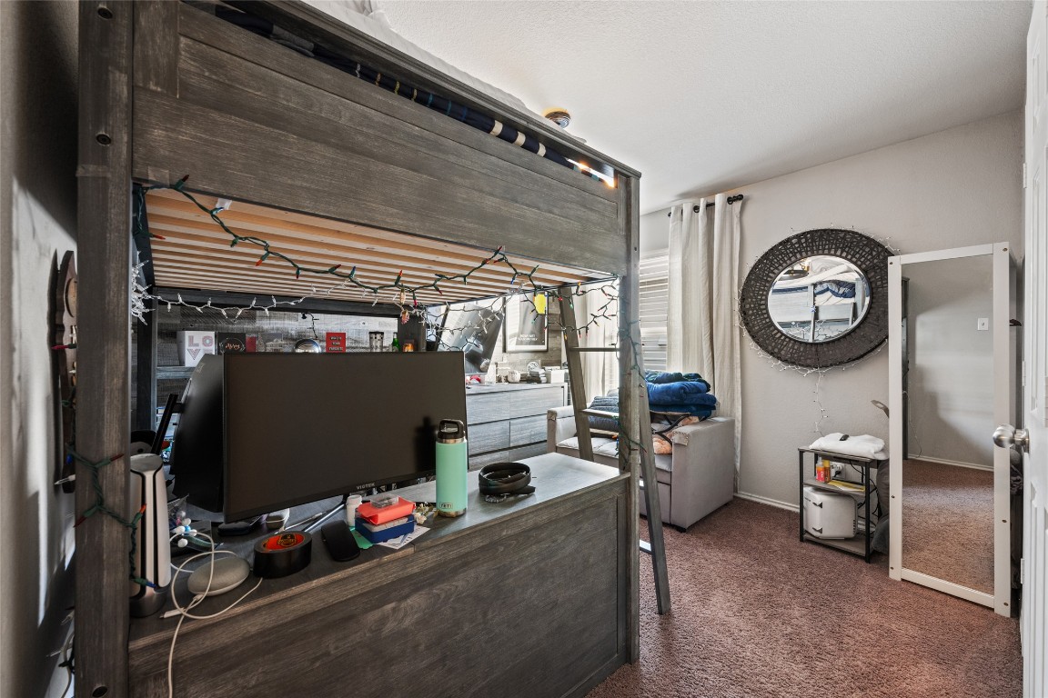 808 Bonnet Boulevard Georgetown, TX 78628 - Photo 25 of 40 a room with gym equipment and a large window