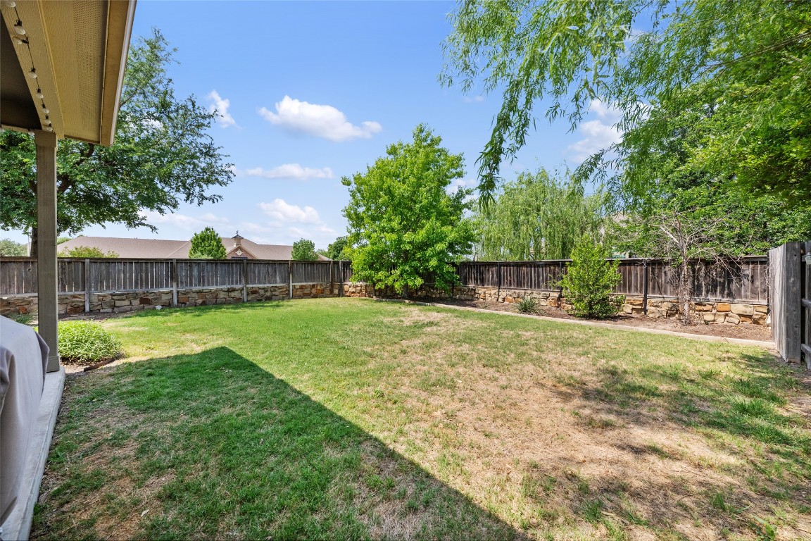 808 Bonnet Boulevard Georgetown, TX 78628 - Photo 33 of 40 a view of a back yard with a table and chair