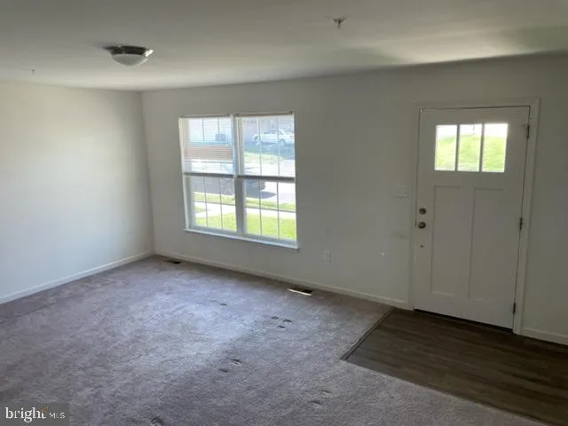an empty room with windows