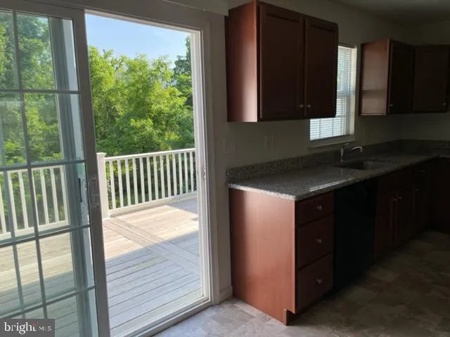 a kitchen with a sink and a window