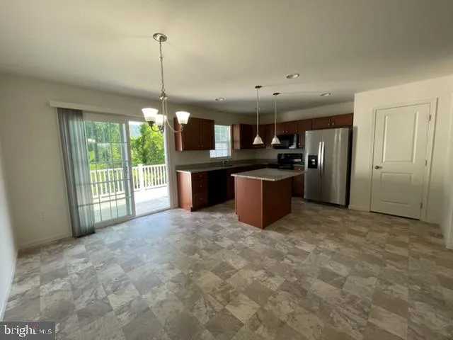 a view of a kitchen with a sink and microwave