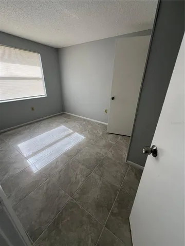 a view of a closet in an empty room