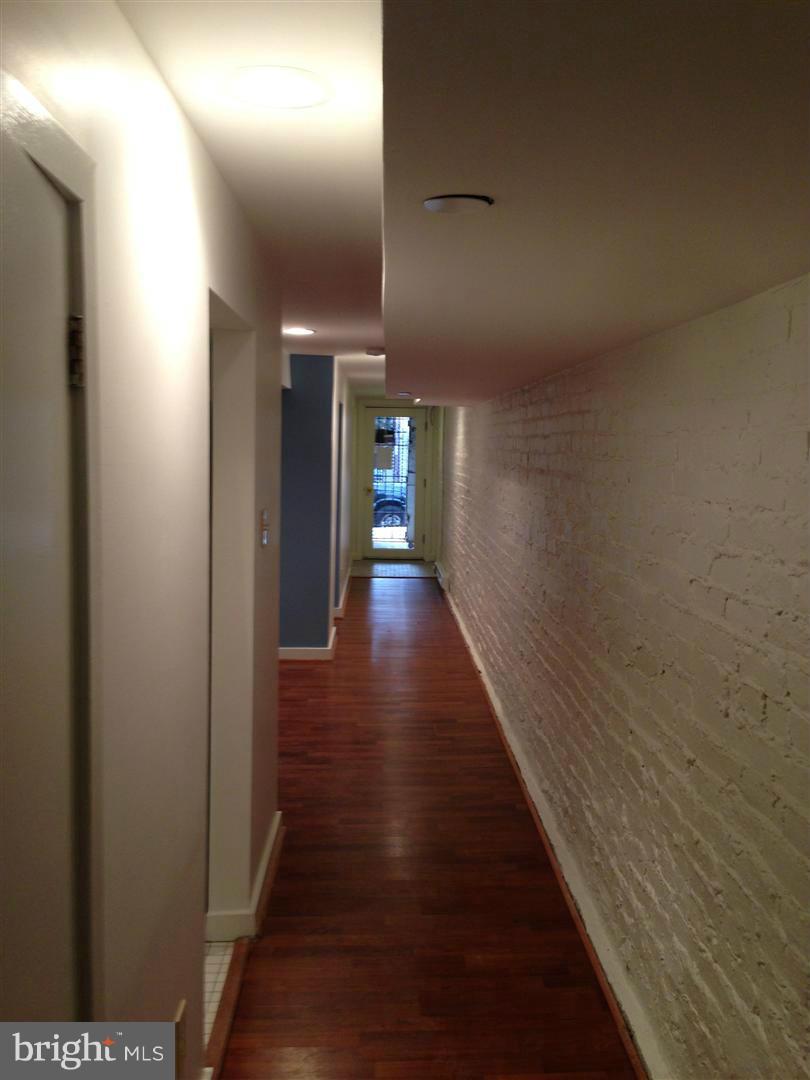 2443 Ontario Road Northwest Washington, DC 20009 - Photo 9 of 30 Hallway facing to street level entrance