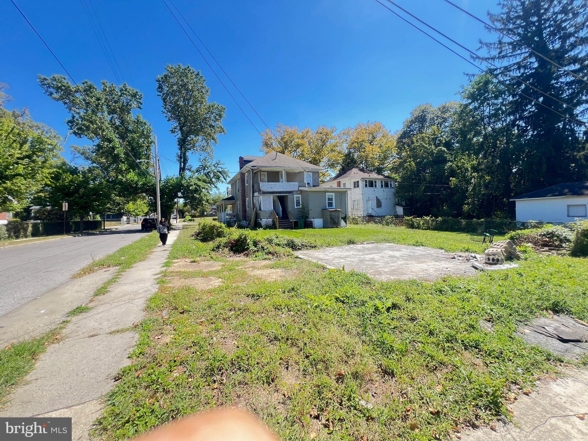 3716 Mohawk Avenue Baltimore, MD 21207 - Photo 3 of 4 a swimming pool with outdoor seating and yard
