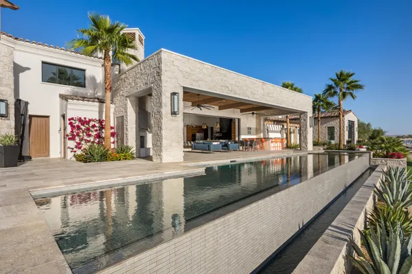a view of swimming pool with outdoor seating