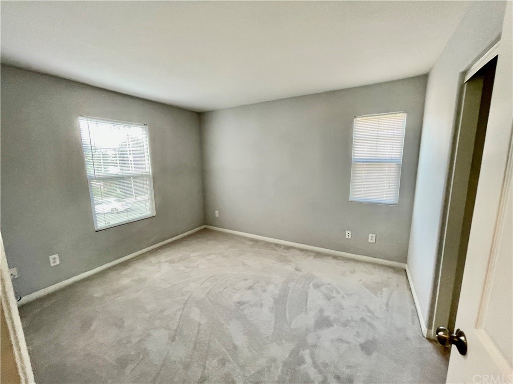 2840 Maxson Road El Monte, CA 91732 - Photo 9 of 14 an empty room with a window and doors