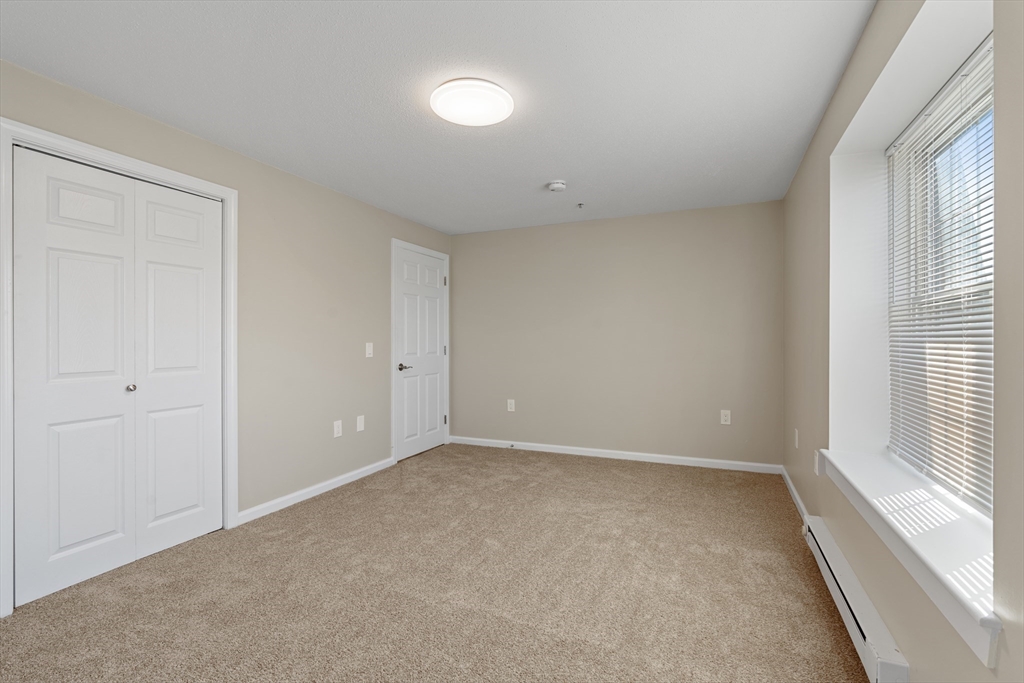 2 Ocean Avenue, Unit 3H Gloucester, MA 01930 - Photo 20 of 28 a view of an empty room with a window