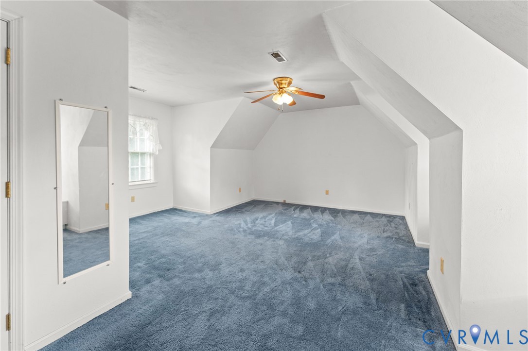 1760 Gloucester Road Gloucester Point, VA 23062 - Photo 33 of 47 Spacious attic room featuring blue carpeting, a ce