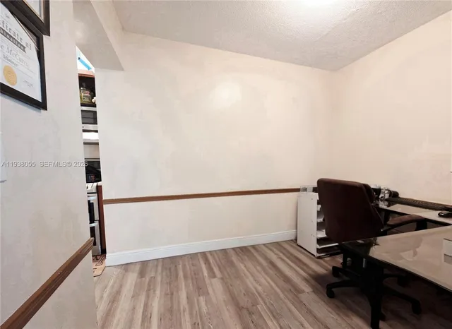 a view of workspace with wooden floor