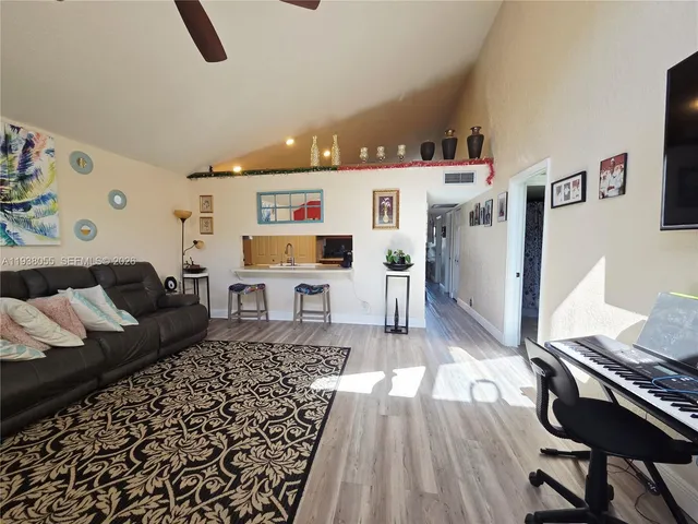a living room with furniture and a rug