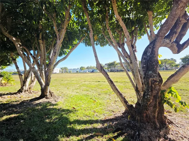 a view of swimming pool with a yard