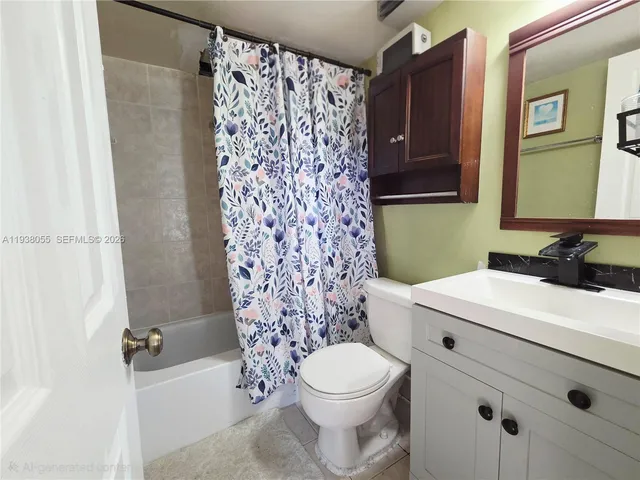 a bathroom with a sink a toilet and shower curtain