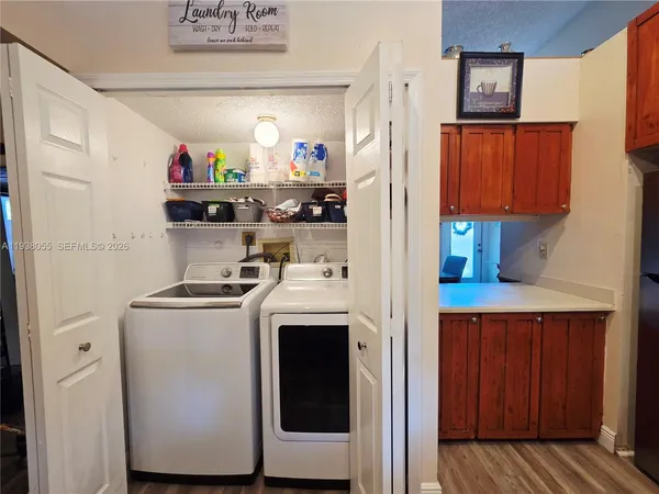 a storage room with washer and dryer
