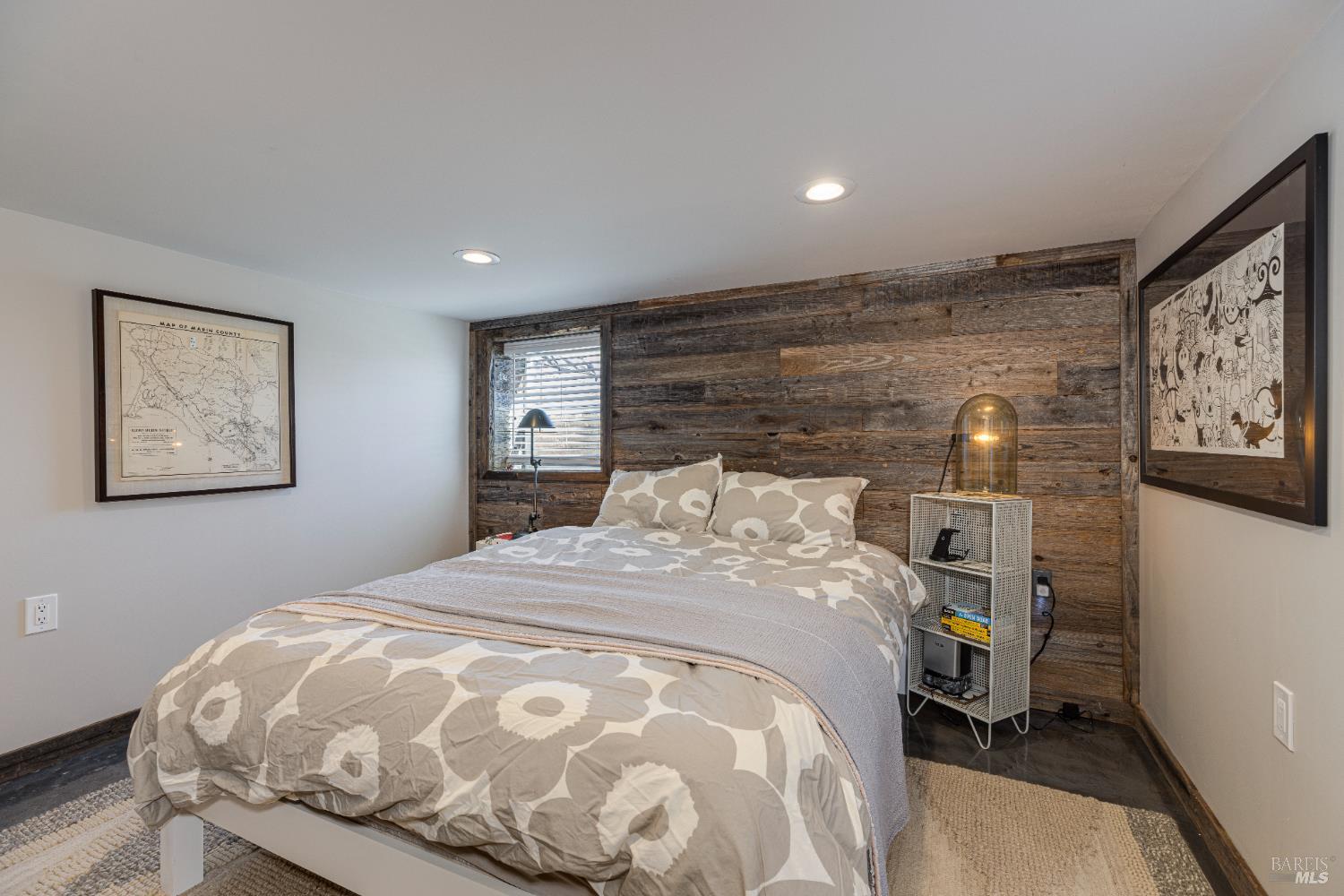 3150 Pepper Road Petaluma, CA 94952 - Photo 39 of 85 The ADU bedroom features recessed lighting, rustic wood wall & a stained concrete floor