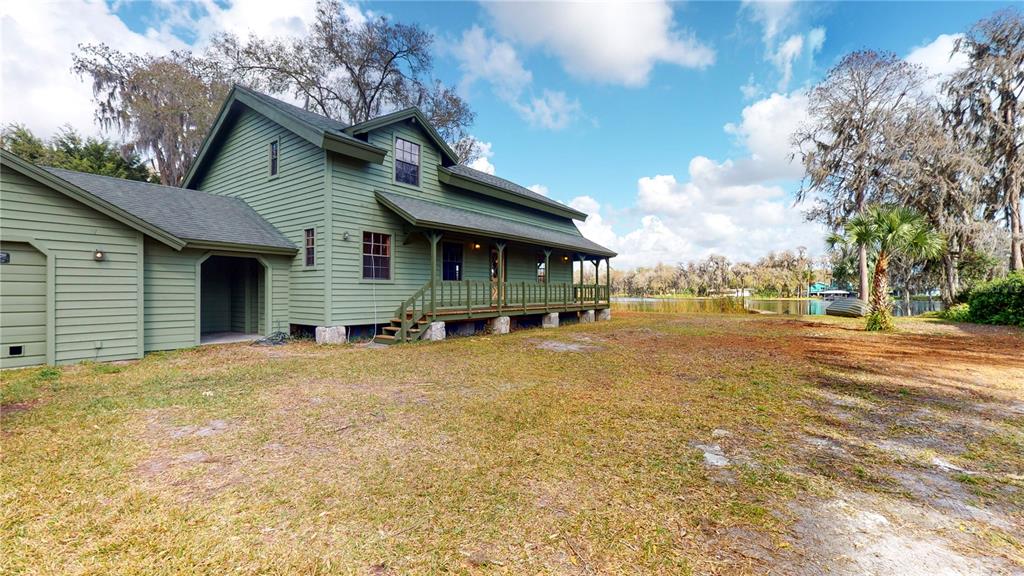 19803 Reading Road Lutz, FL 33558 - Photo 5 of 48 a view of a house with a yard and garage