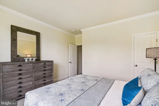 a bed room with a bed and a mirror