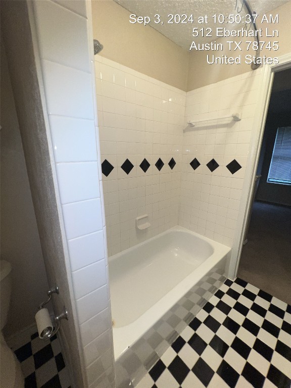 512 Eberhart Lane, Unit 103 Austin, TX 78745 - Photo 12 of 18 a bathroom with a bathtub and shower