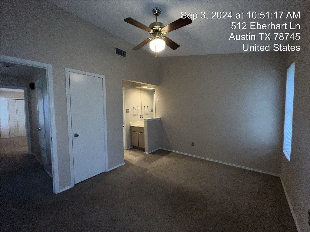 512 Eberhart Lane, Unit 103 Austin, TX 78745 - Photo 14 of 18 a view of an empty room with a window