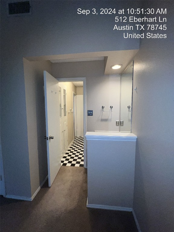 512 Eberhart Lane, Unit 103 Austin, TX 78745 - Photo 15 of 18 a spacious bathroom with a shower a sink and a mirror