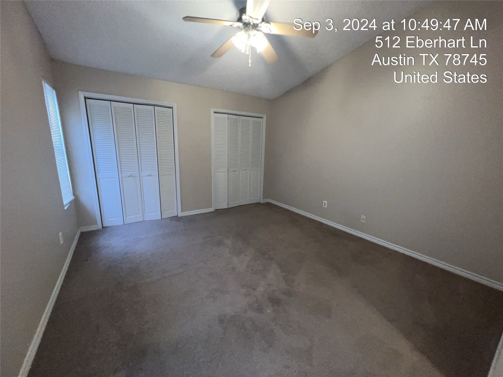 512 Eberhart Lane, Unit 103 Austin, TX 78745 - Photo 9 of 18 a view of an empty room and chandelier fan