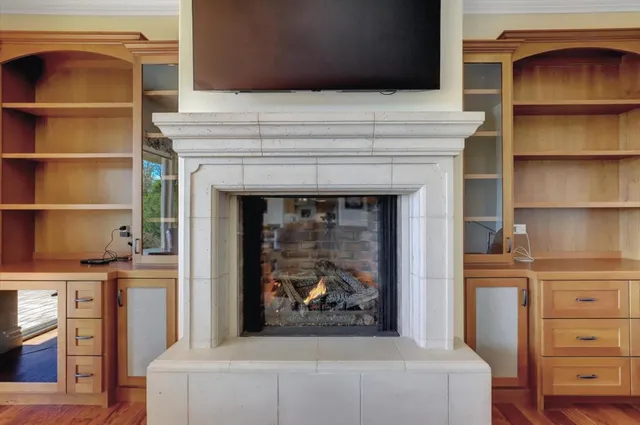 a kitchen with stainless steel appliances granite countertop a sink and a refrigerator
