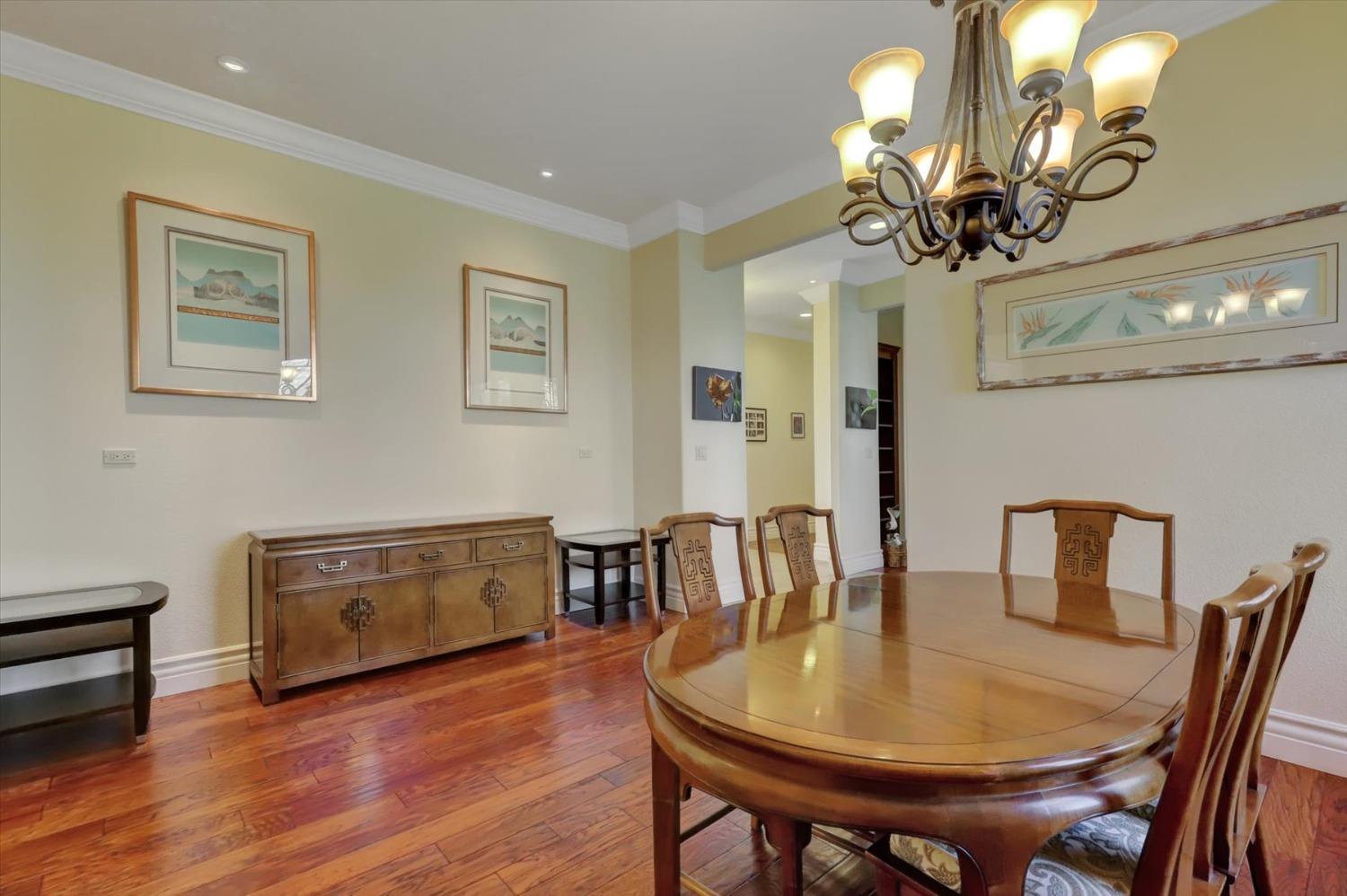13197 American Ranch Court Grass Valley, CA 95949 - Photo 17 of 77 a view of a dining room with furniture and wooden floor