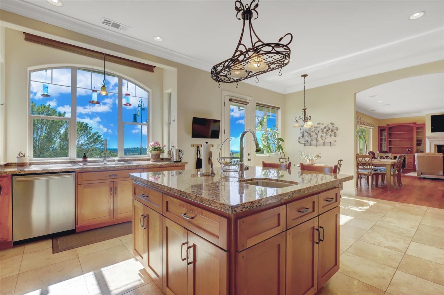 13197 American Ranch Court Grass Valley, CA 95949 - Photo 25 of 77 a kitchen with center island and windows