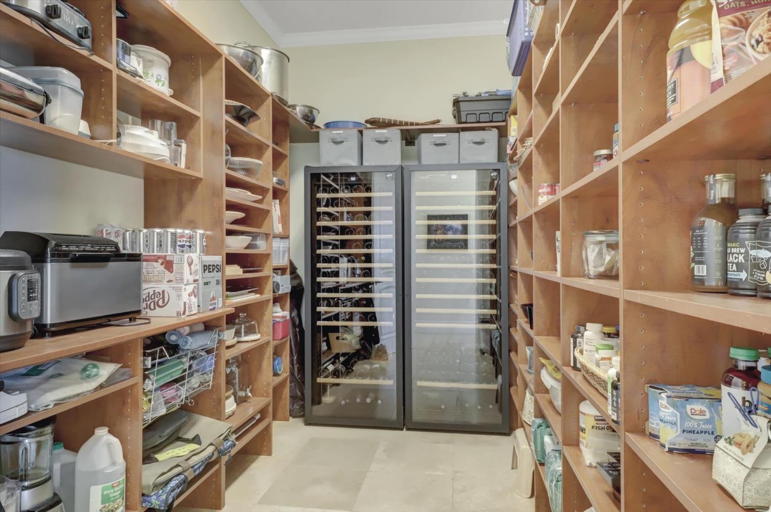 13197 American Ranch Court Grass Valley, CA 95949 - Photo 32 of 77 Large walk in pantry with two wine refrigerators holdin