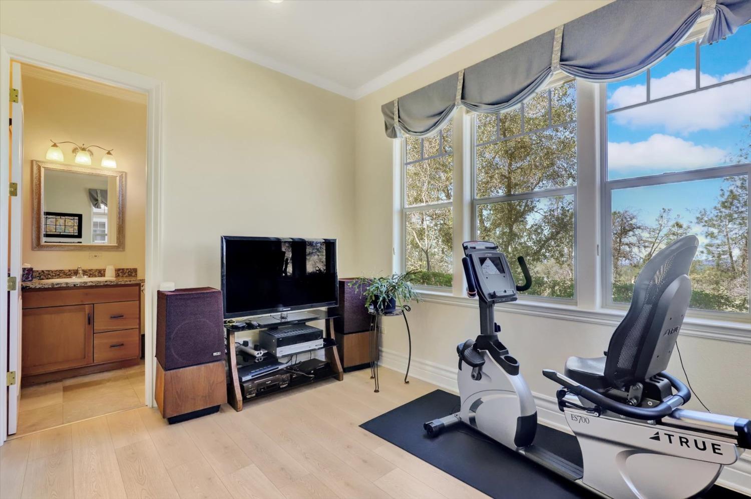 13197 American Ranch Court Grass Valley, CA 95949 - Photo 46 of 77 a view of a workspace with furniture and a window