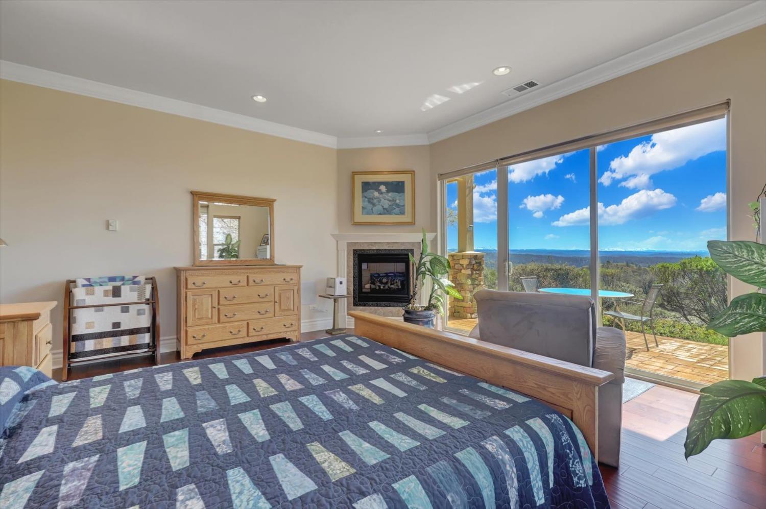 13197 American Ranch Court Grass Valley, CA 95949 - Photo 50 of 77 a bedroom with a bed and glass door