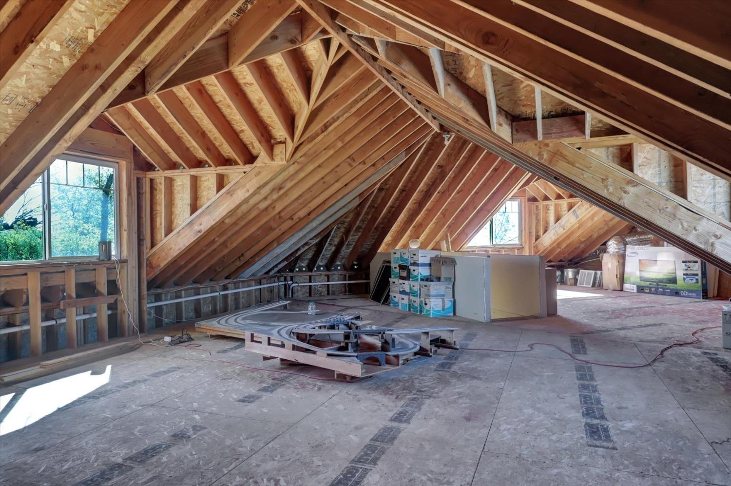13197 American Ranch Court Grass Valley, CA 95949 - Photo 66 of 77 UNFINISHED SPACE ABOVE 3 CAR GARAGE HAS POWER AND DUCTING FOR COOLING AND HEATING