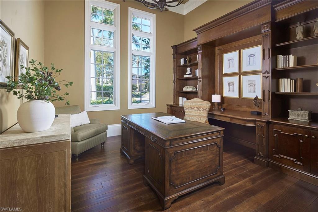 2944 Bellflower Lane Naples, FL 34105 - Photo 21 of 48 a kitchen with a stove and a potted plant