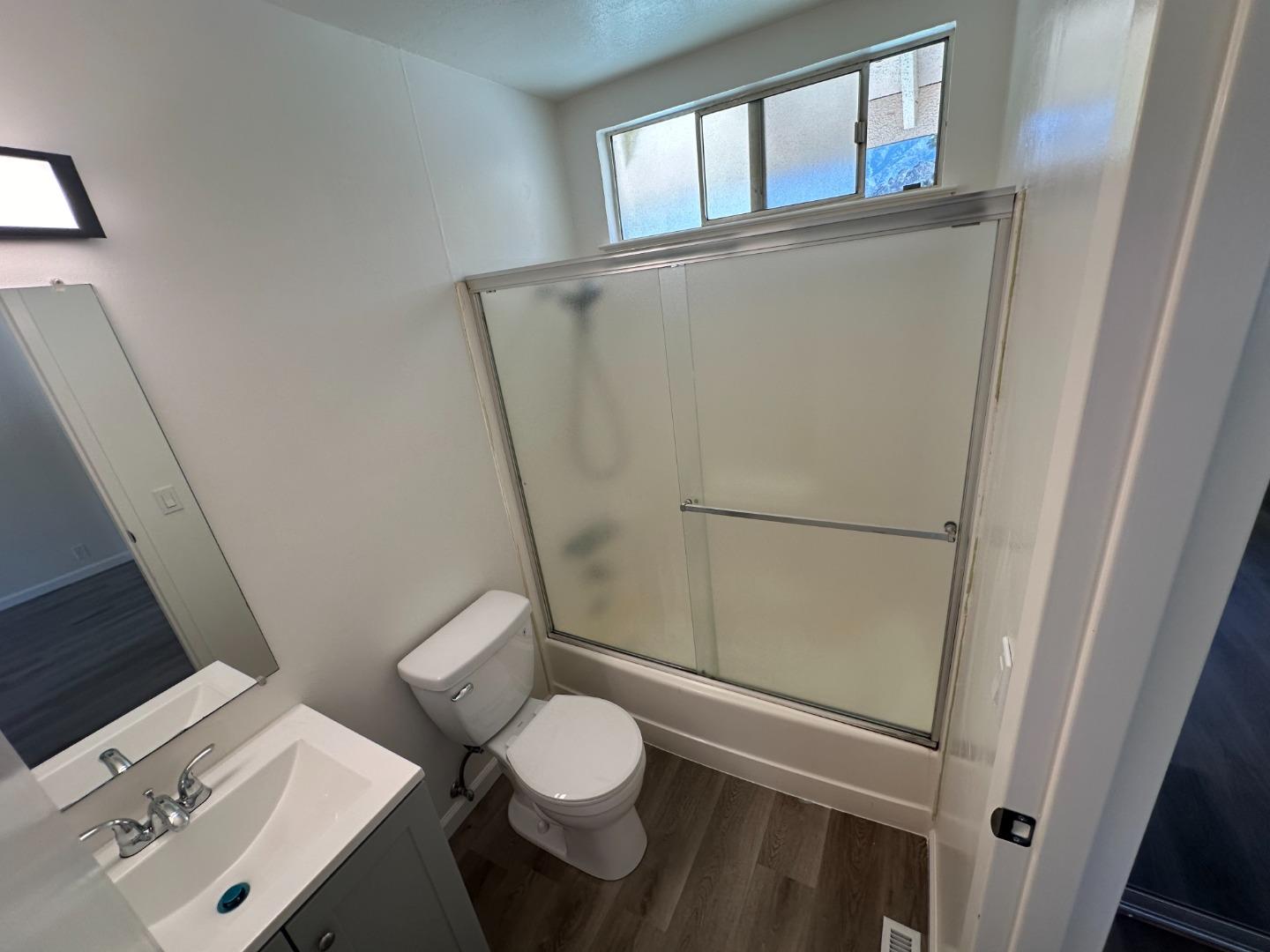 1242 Terra Nova Boulevard Pacifica, CA 94044 - Photo 11 of 26 a bathroom with a toilet and a shower