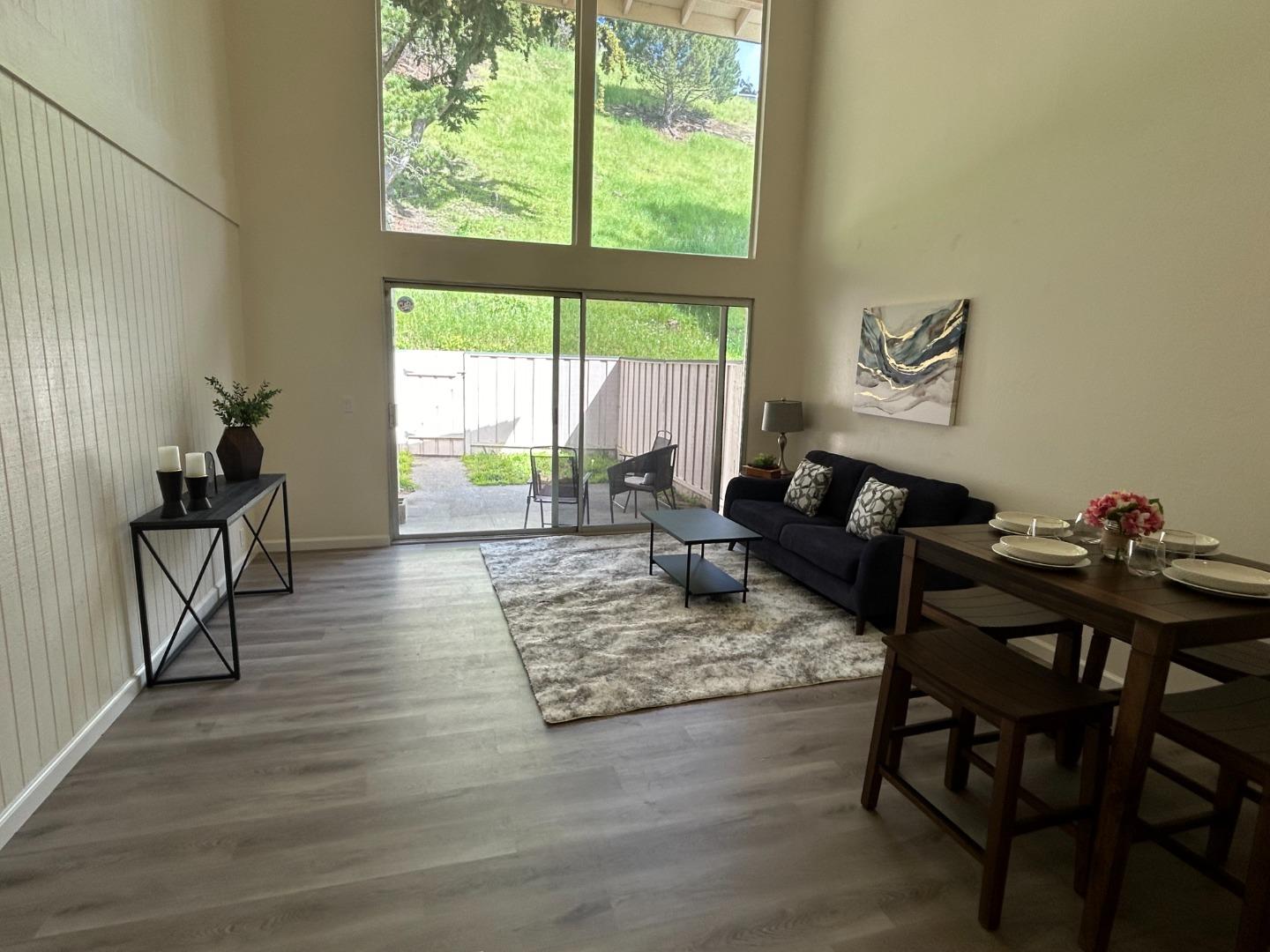 1242 Terra Nova Boulevard Pacifica, CA 94044 - Photo 3 of 26 a living room with furniture and a large window