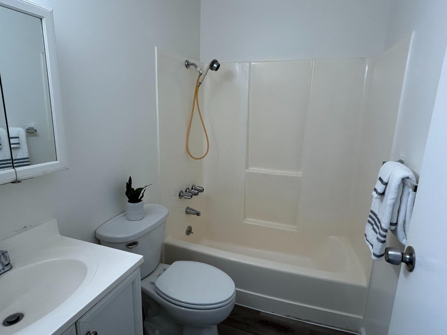 1242 Terra Nova Boulevard Pacifica, CA 94044 - Photo 7 of 26 a bathroom with a toilet sink and shower