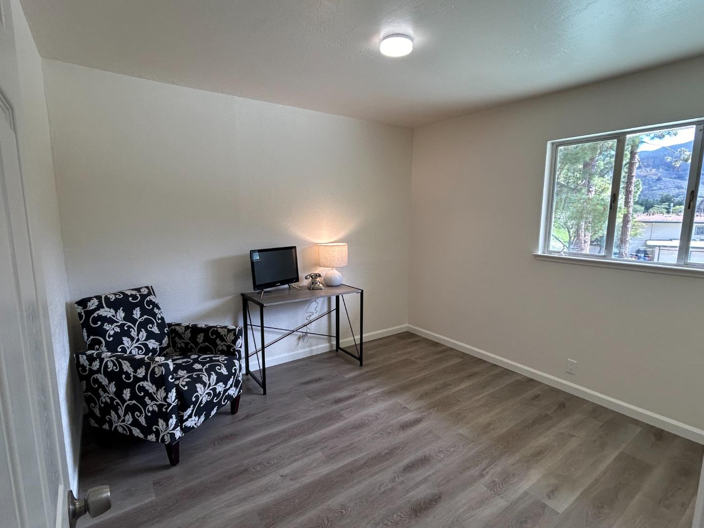 1242 Terra Nova Boulevard Pacifica, CA 94044 - Photo 10 of 26 a living room with wooden floor