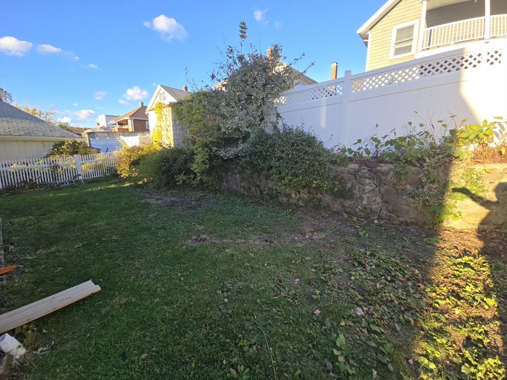 58 Creeley Road, Unit 1 Belmont, MA 02478 - Photo 15 of 15 a view of a back yard of the house