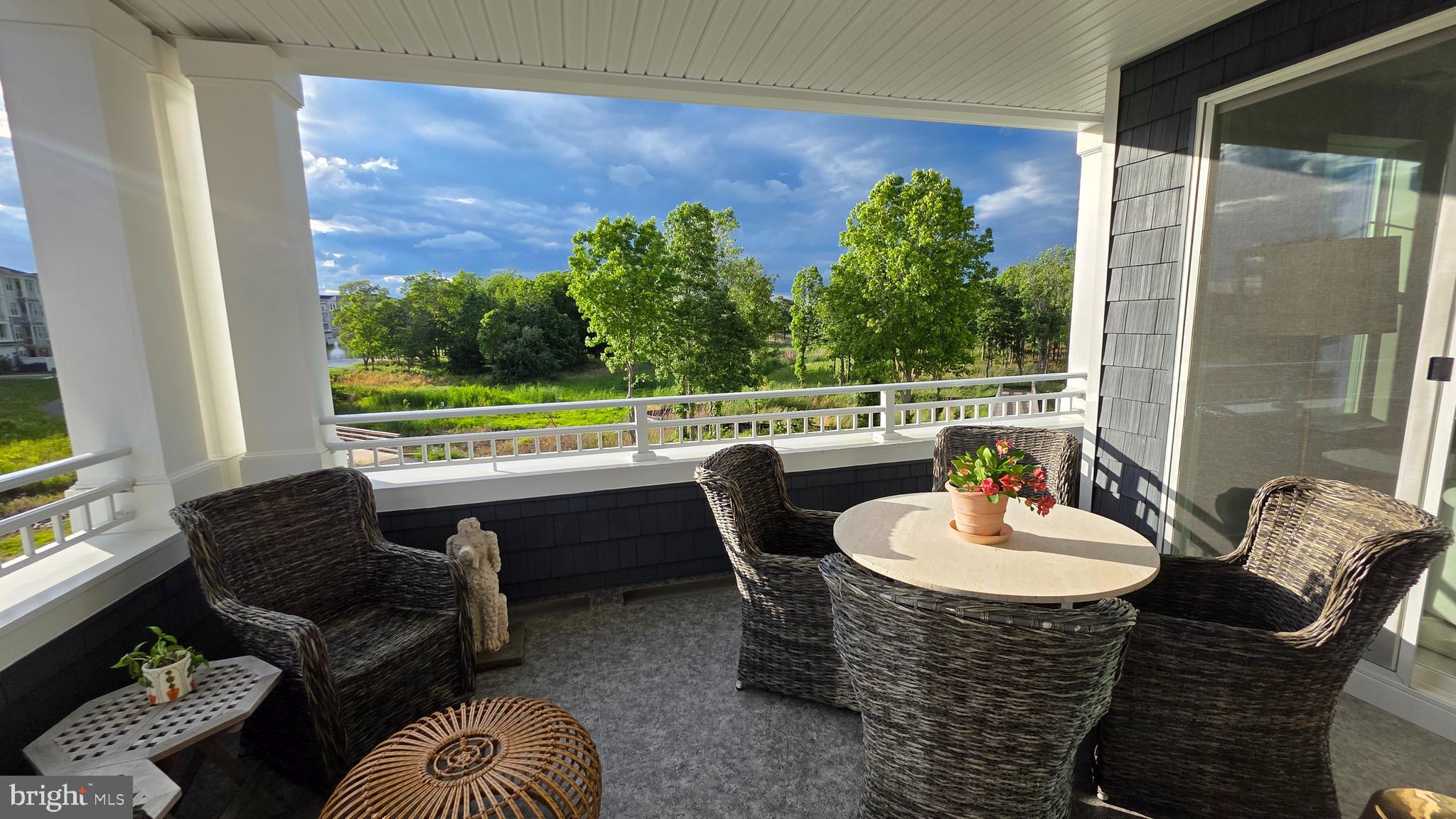 230 Switchgrass Way, Unit 21 Chester, MD 21619 - Photo 6 of 66 a outdoor dining space with furniture and outdoor view