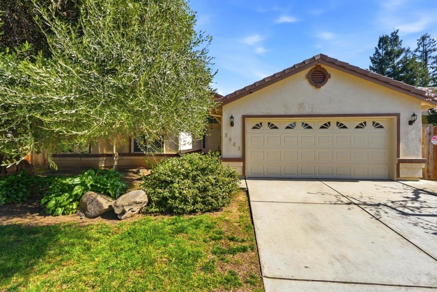 3882 Pintail Court Merced, CA 95340 - Photo 1 of 21 a front view of a house with a yard