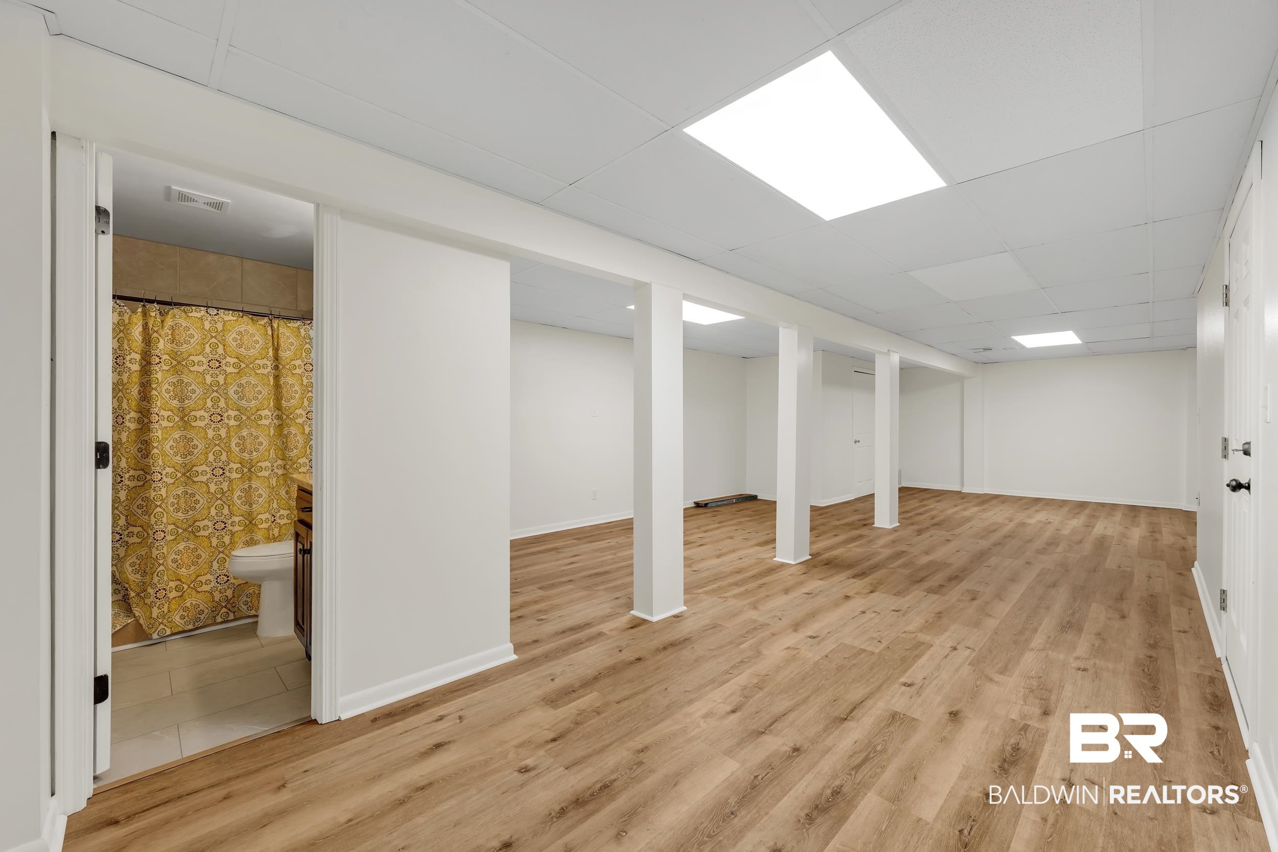 2 Navy Lane Daphne, AL 36527 - Photo 25 of 28 Finished basement featuring a paneled ceiling and light wood-style floors