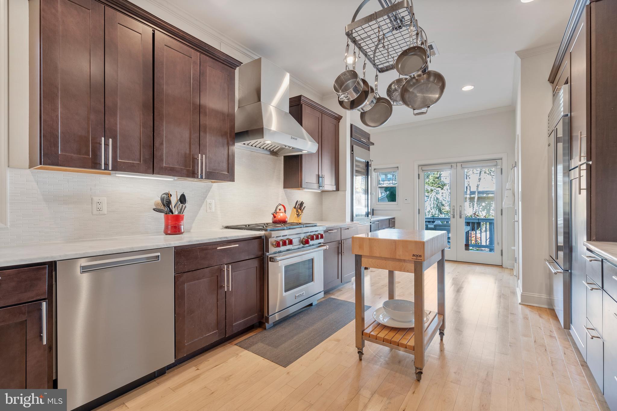 33 W Street Northwest, Unit 1 Washington, DC 20001 - Photo 13 of 36 a kitchen with a sink cabinets and stainless steel appliances